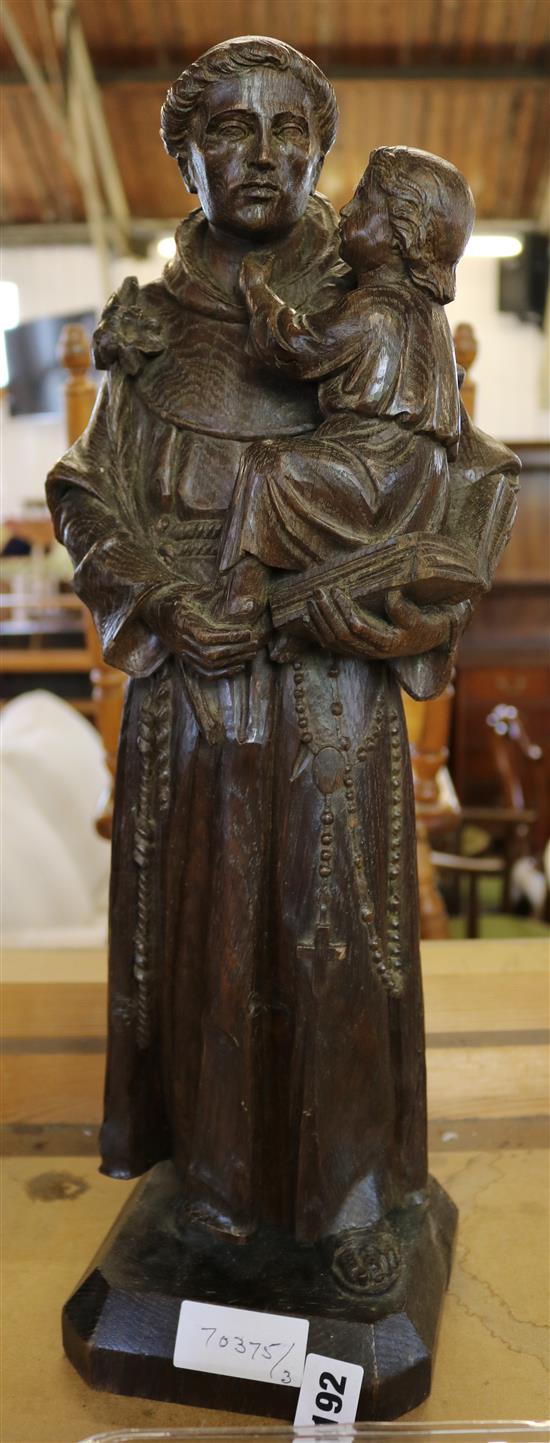 Carved figure of 19th Century Saint with child
